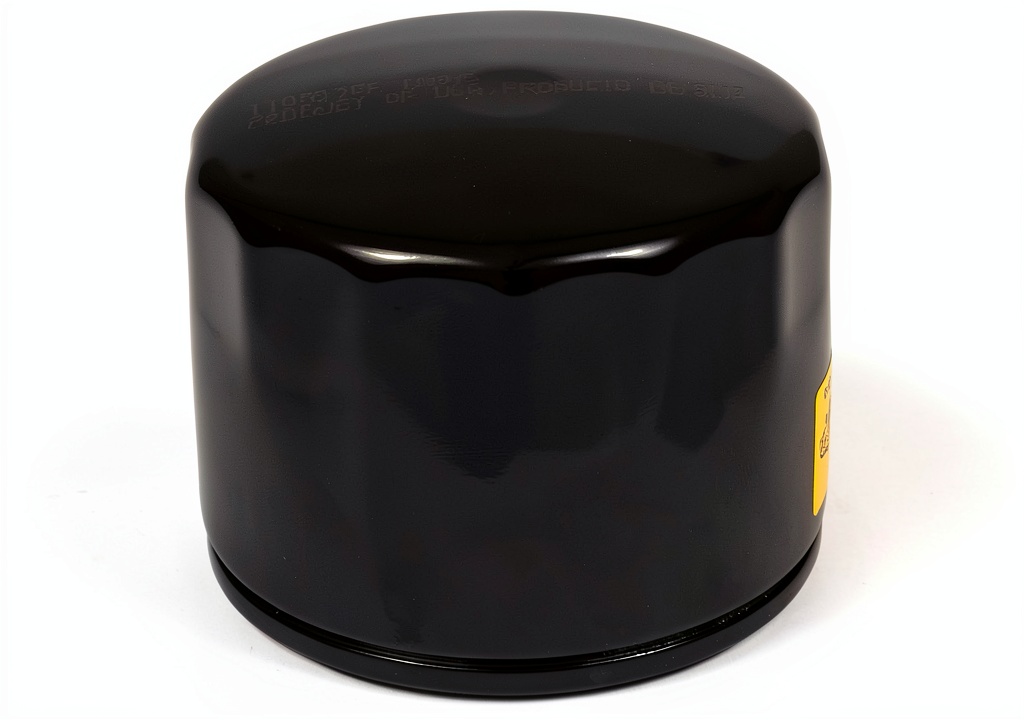 Briggs Stratton 842921 oil filter shown next to a lawn mower engine
